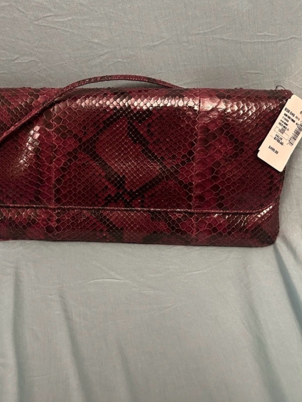 Elegant Burgundy Snake Print
Clutch.